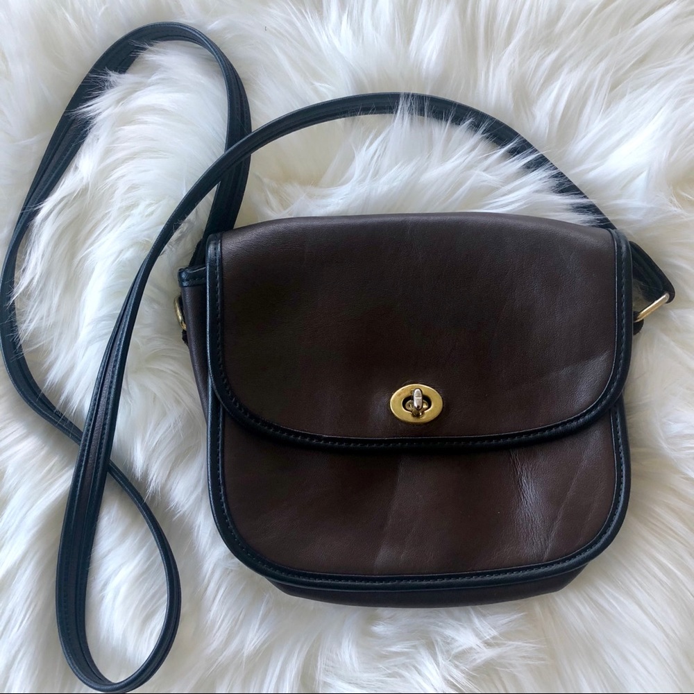 Brown faux leather shoulder bag with black strap